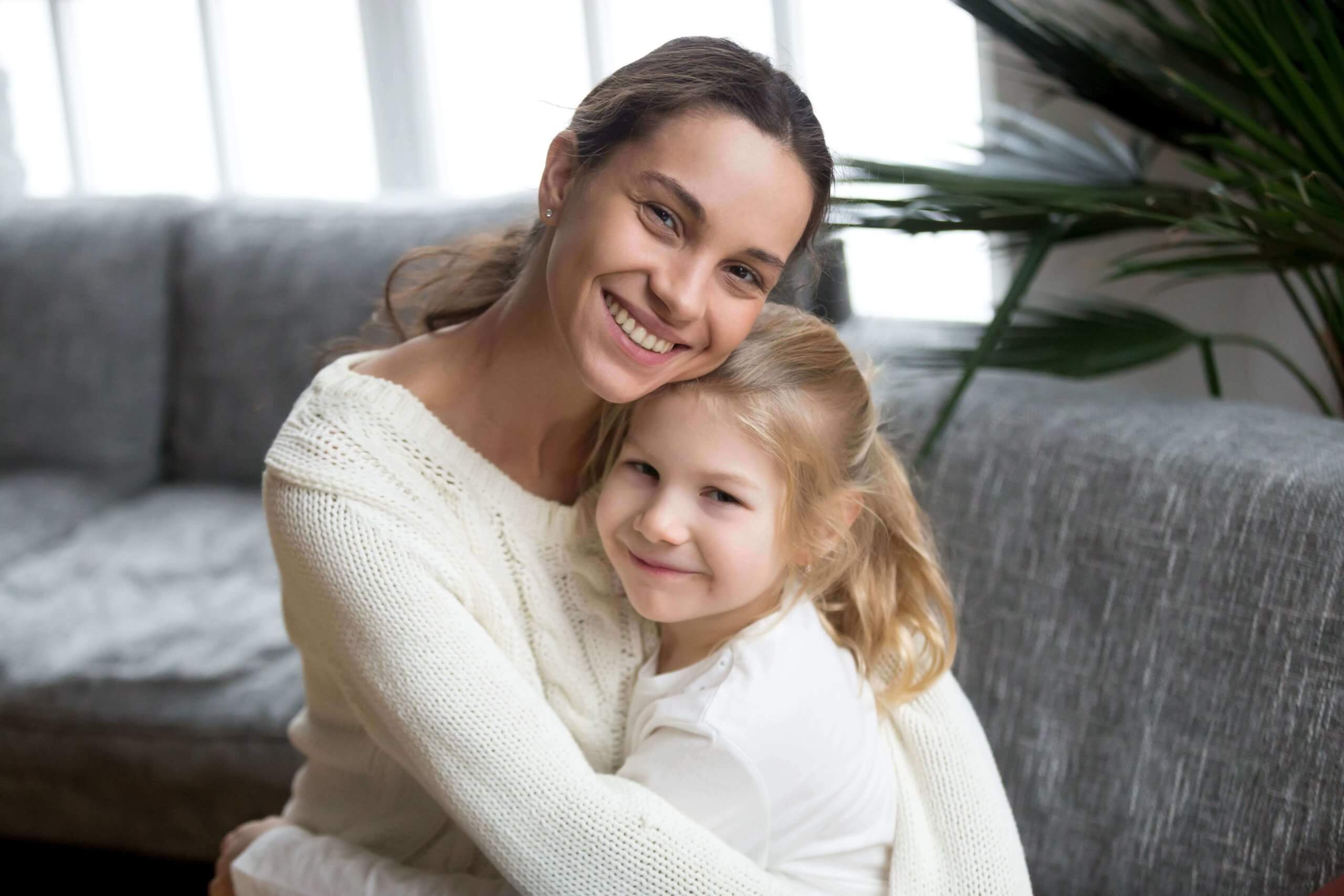 portrait-happy-loving-single-mother-hugging-cute-little-daughter-min (1) (1)